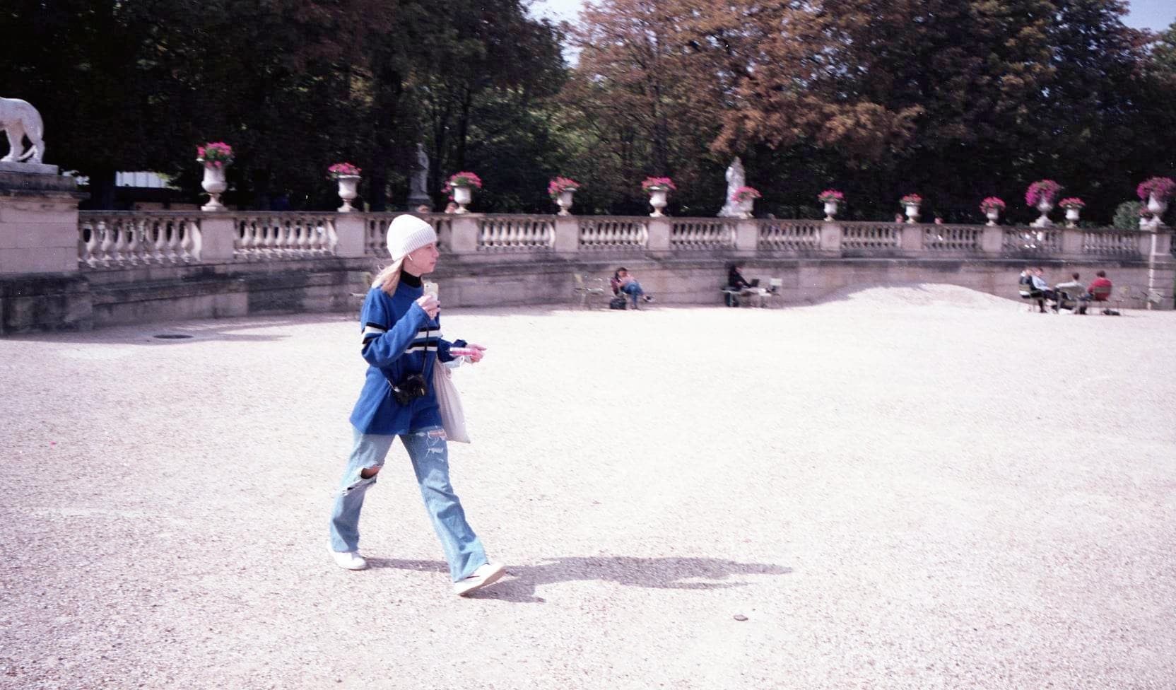 woman walking through a park